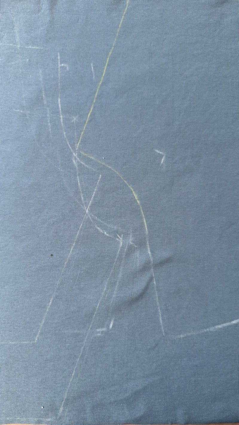 Close-up of the chalk pattern with one line corrected in yellow